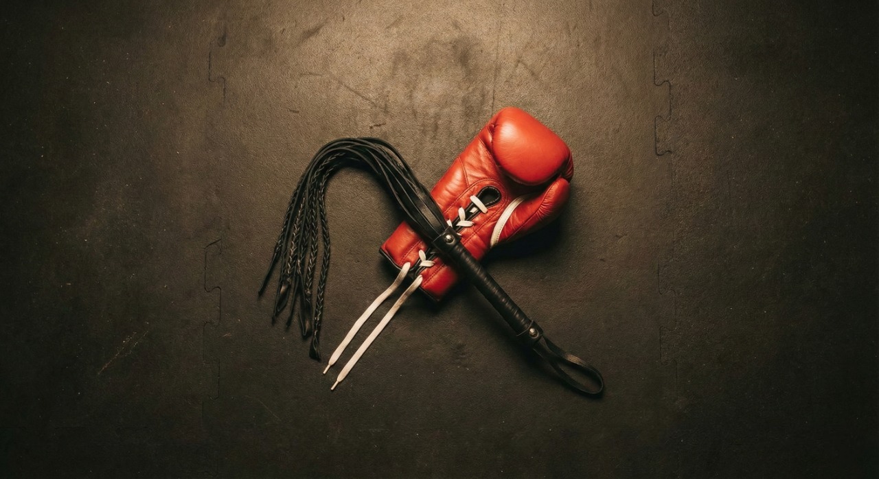 red-glove-crossed-with-black-flogger