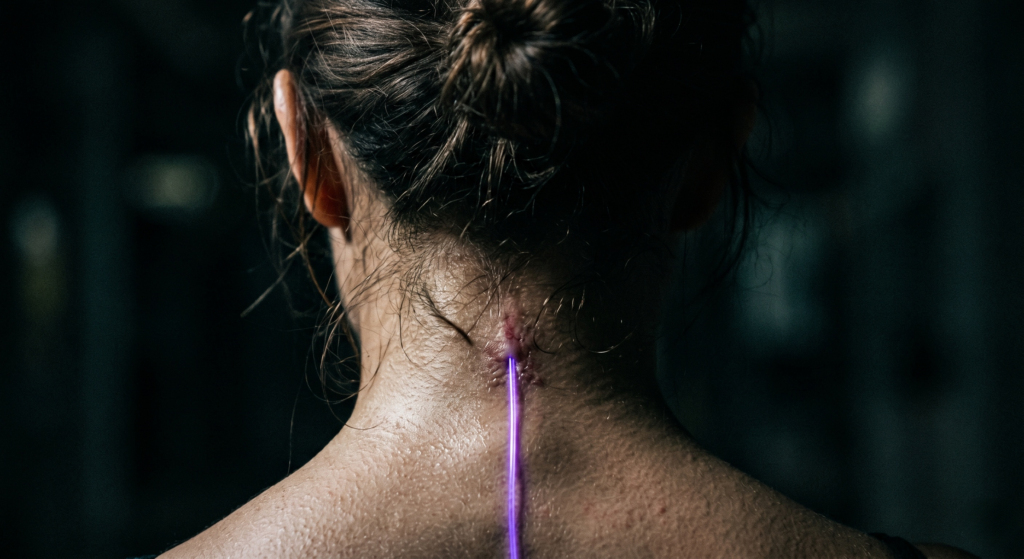 raw-iphone-ugc-photo-of-neon-led-spine-implant-on-human-skin